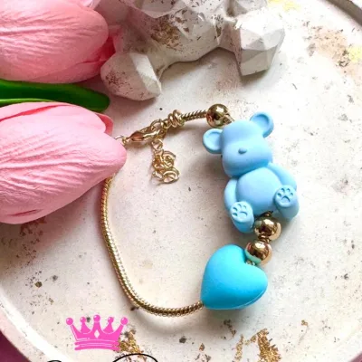 Pulsera tipo Pandora en rodio y balines en acero, oso en resina